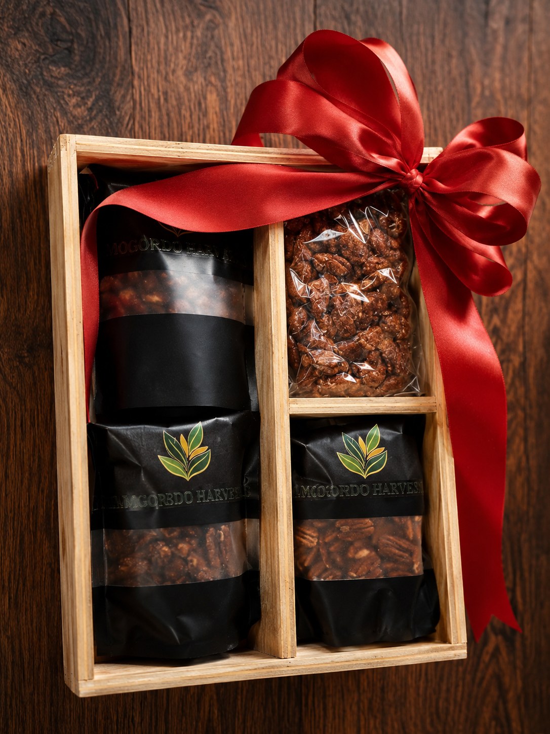 Ribbon-tied Alamogordo Harvest corporate gift box with candied and glazed pecan pouches